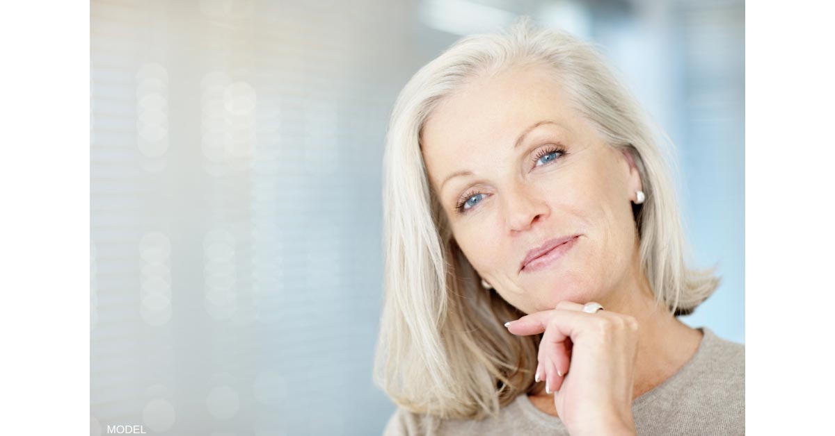 Woman Thinking about Removing breast implants