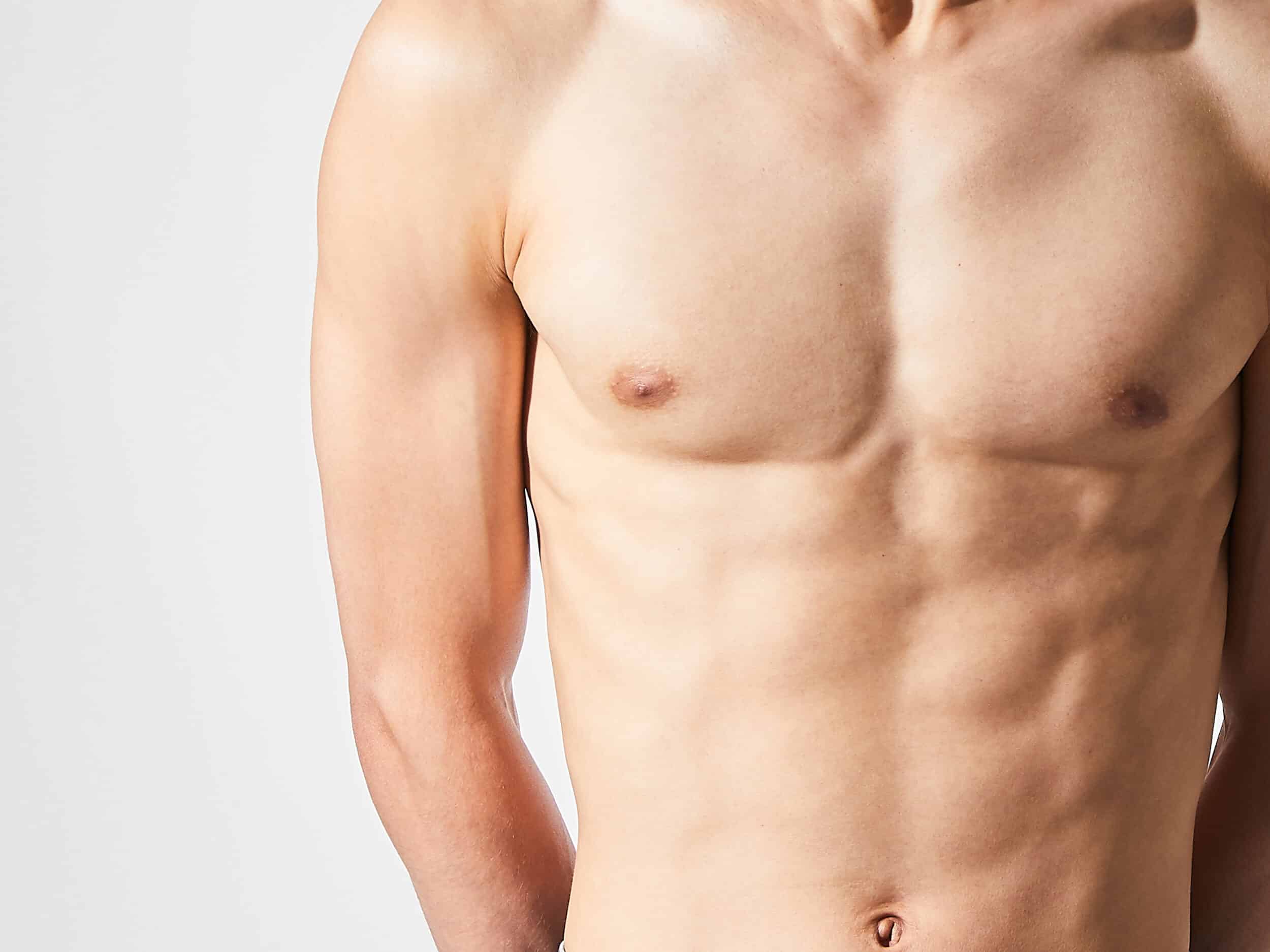 Close up of defined male chest after male breast reduction in Northbrook, IL