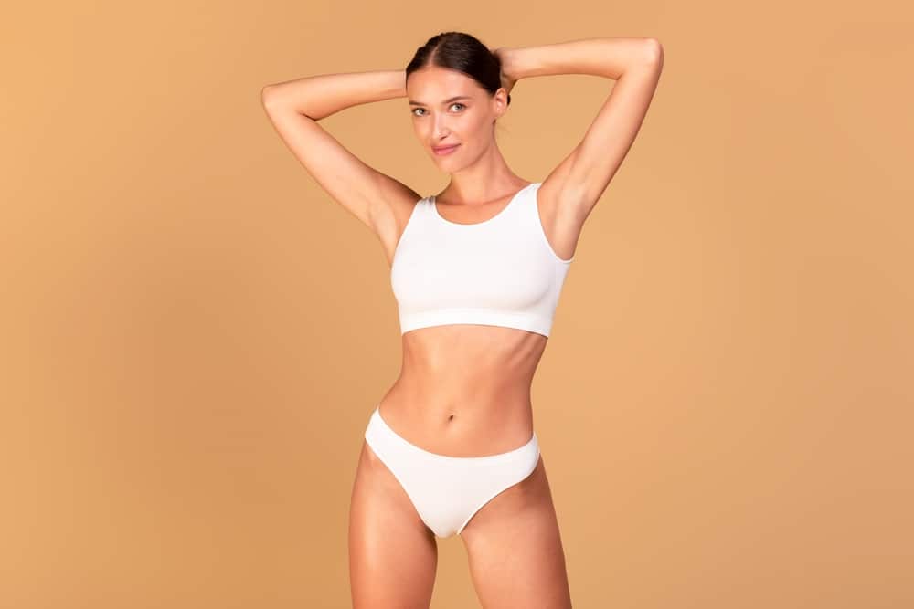 Woman with slim, contoured body after liposuction in Northbrook, IL.